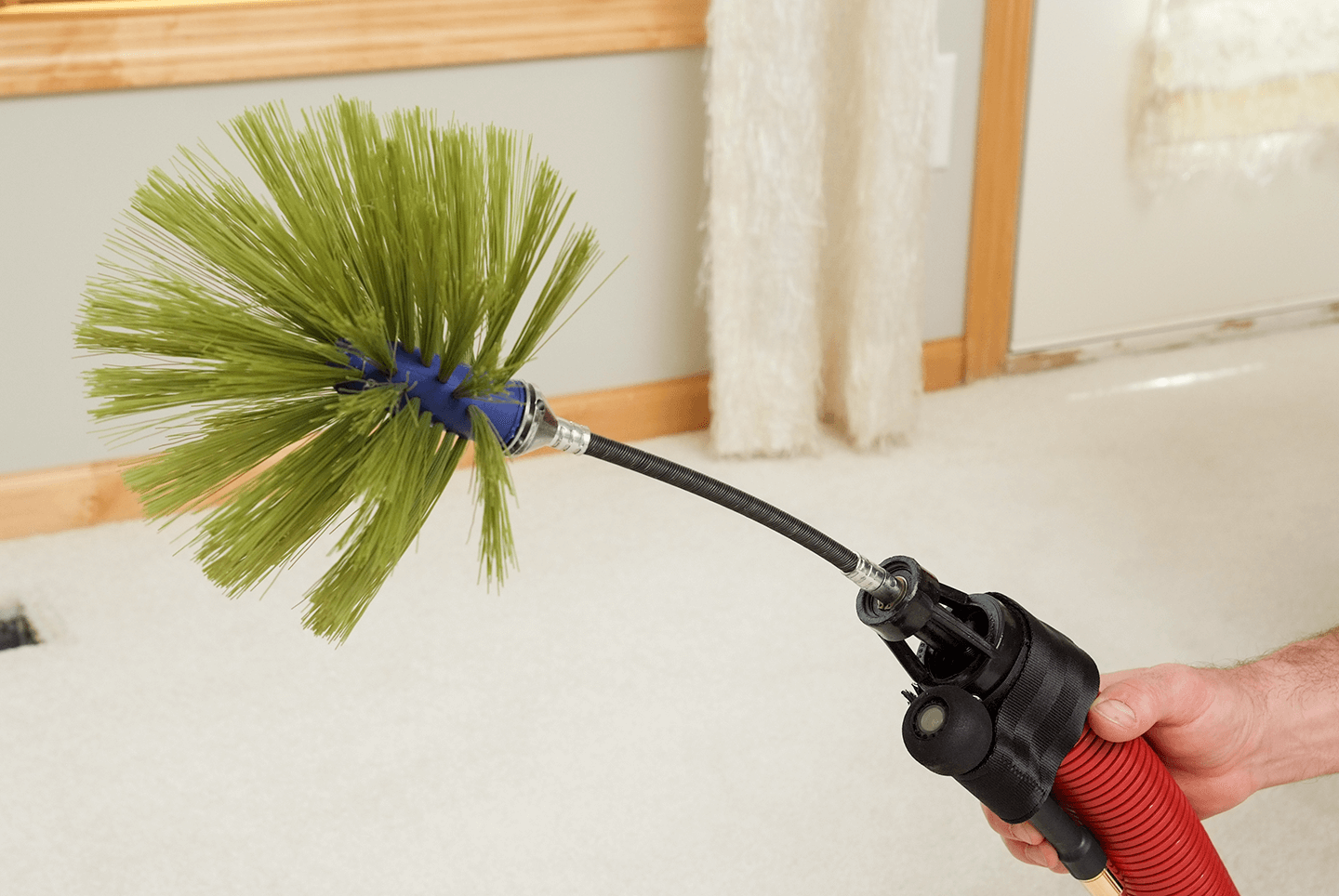 Rotobrush video inspection camera attached to hose